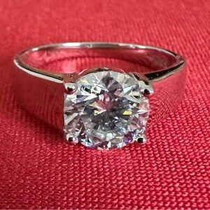 Radiant Sterling Silver Ring with Moissanite and Intricate Detailing